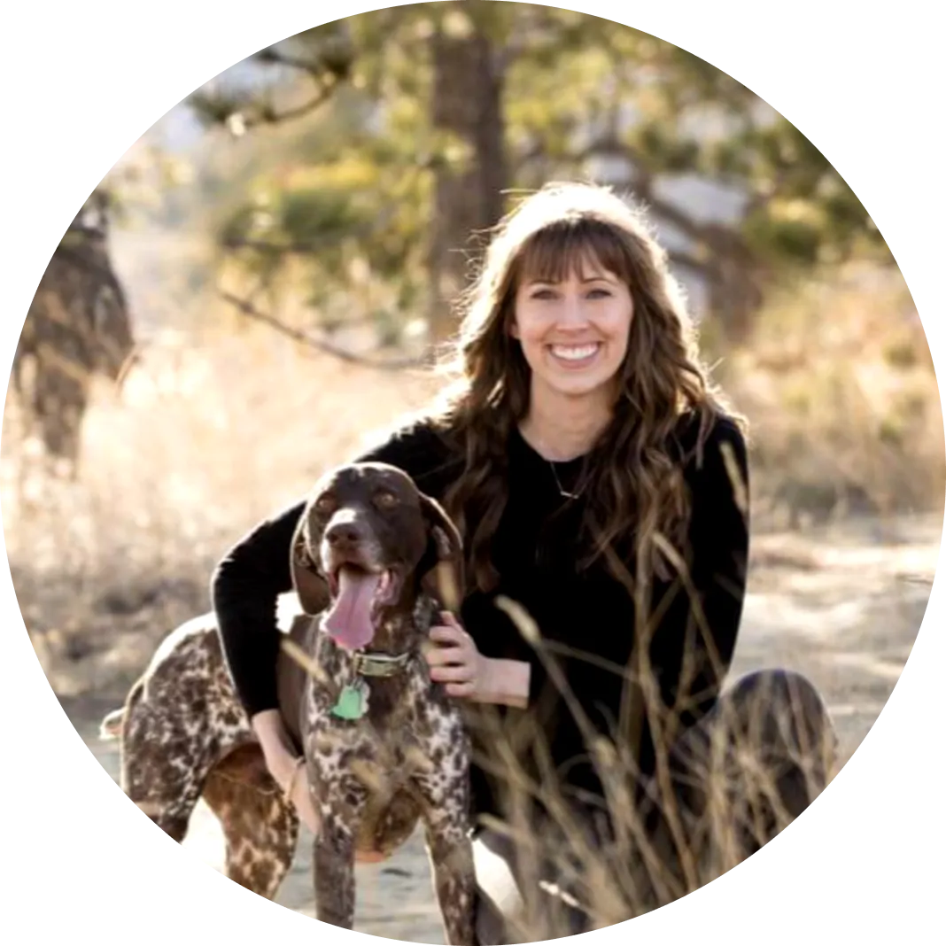 Kayla Erickson posing for a photo with her dog Tye